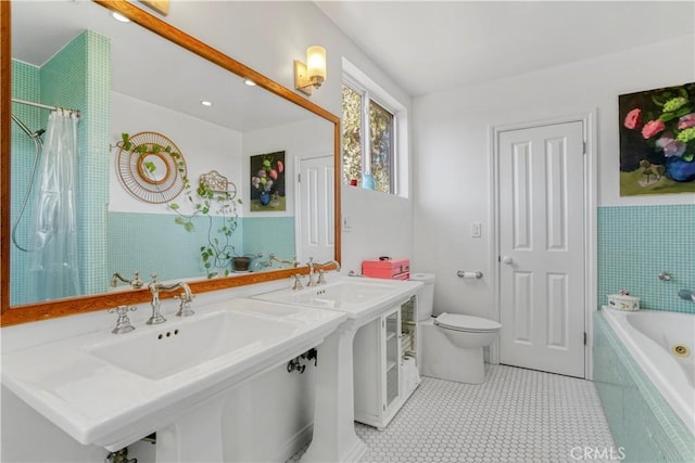 full bathroom with a shower with shower curtain, toilet, a sink, a tub, and tile patterned floors