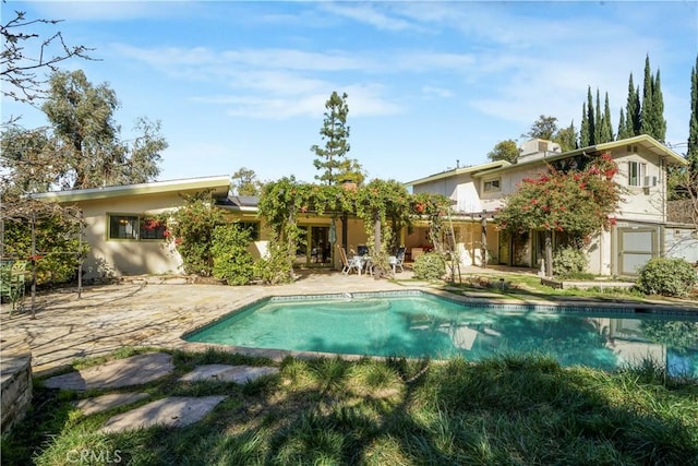 outdoor pool featuring a patio