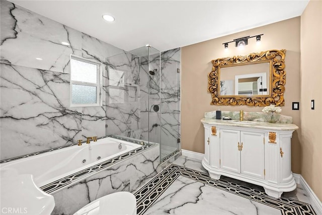 bathroom featuring marble finish floor, a marble finish shower, vanity, a whirlpool tub, and baseboards