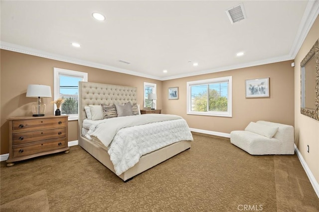 carpeted bedroom featuring visible vents, crown molding, baseboards, and multiple windows