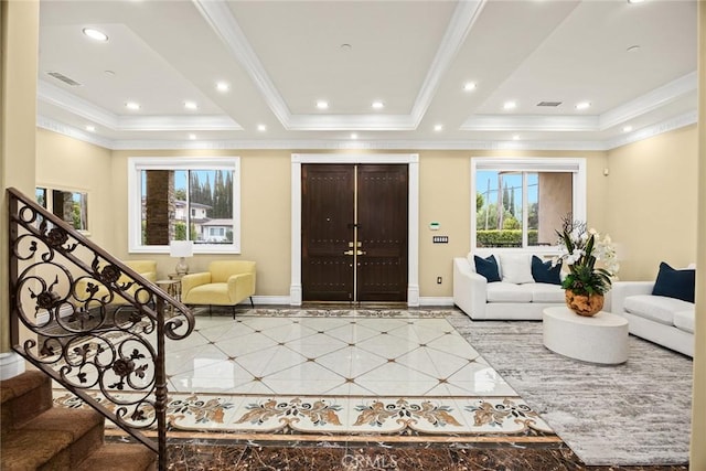 tiled foyer entrance featuring baseboards, visible vents, a raised ceiling, stairs, and recessed lighting