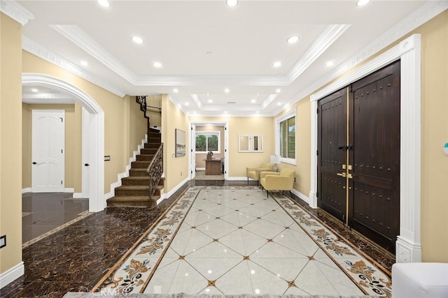 foyer entrance with baseboards, a raised ceiling, stairway, crown molding, and recessed lighting