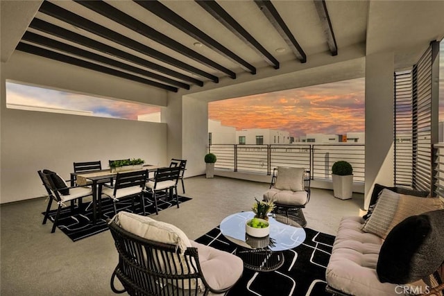 living room featuring beamed ceiling