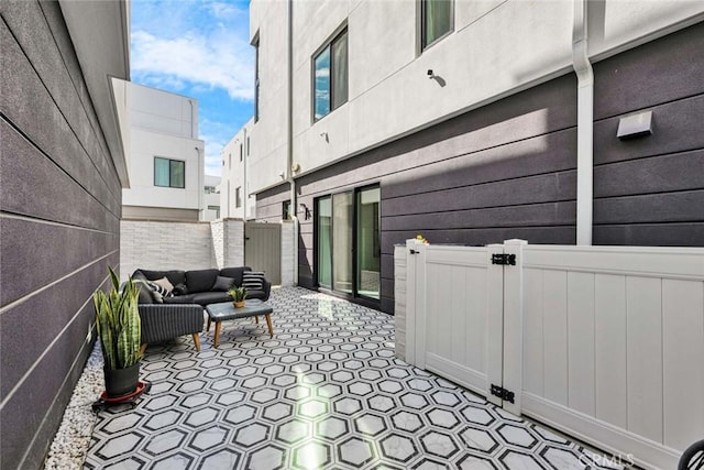 view of patio / terrace with fence and an outdoor living space