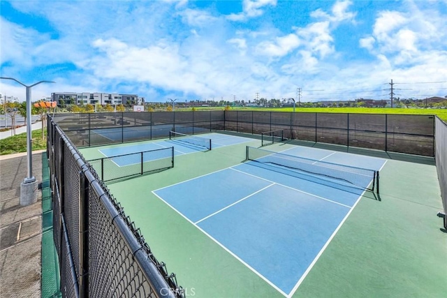 view of sport court with fence