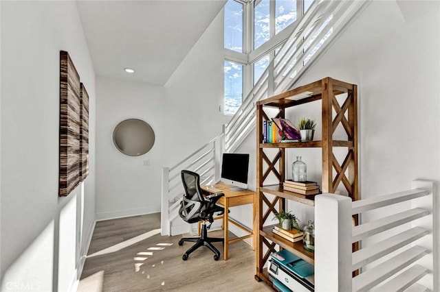 office with baseboards and wood finished floors