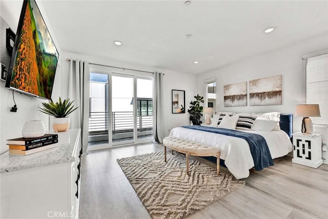 bedroom featuring recessed lighting, light wood-style flooring, and access to exterior