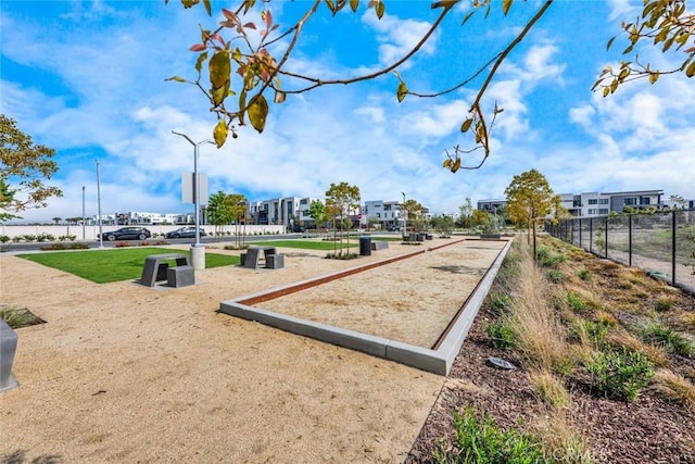 view of community featuring fence