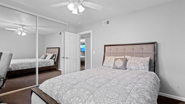 bedroom featuring a ceiling fan, a closet, visible vents, and baseboards