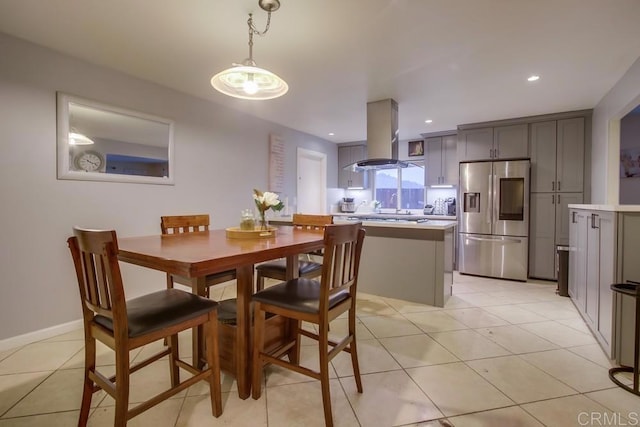 dining space featuring recessed lighting, baseboards, and light tile patterned floors