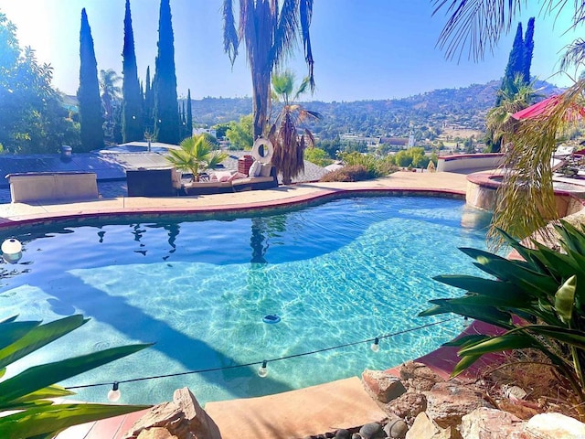 pool featuring a hot tub