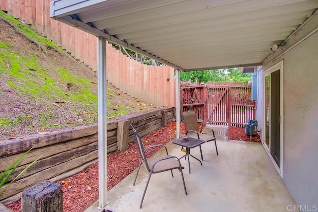 view of patio / terrace featuring fence