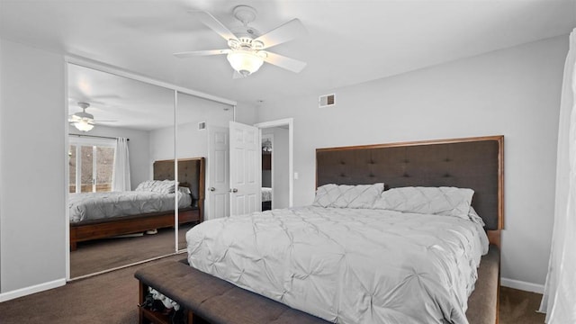 bedroom featuring baseboards, visible vents, a ceiling fan, carpet flooring, and a closet