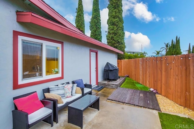 view of patio / terrace featuring fence, an outdoor hangout area, and area for grilling