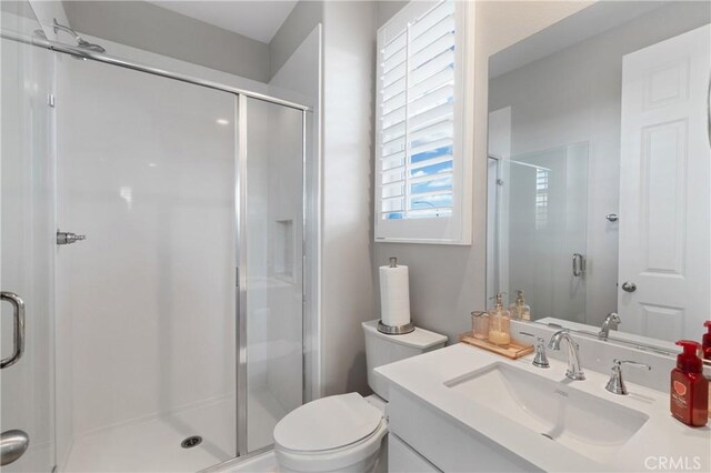 29945 Urtica Ct, Menifee, CA 92584 - bathroom featuring a shower stall, toilet, and vanity