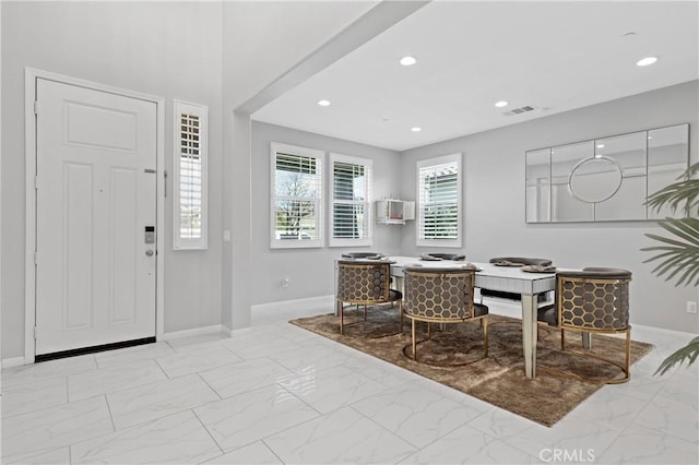 dining space with marble finish floor, baseboards, and recessed lighting