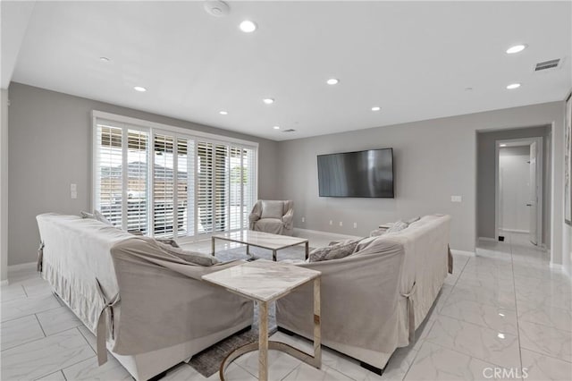 living area with recessed lighting, marble finish floor, and visible vents