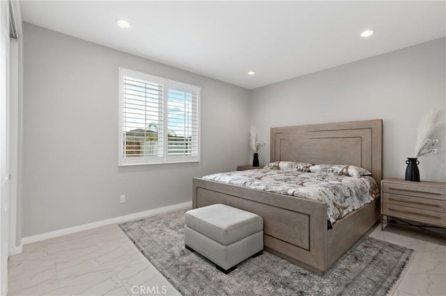 bedroom featuring recessed lighting, marble finish floor, and baseboards