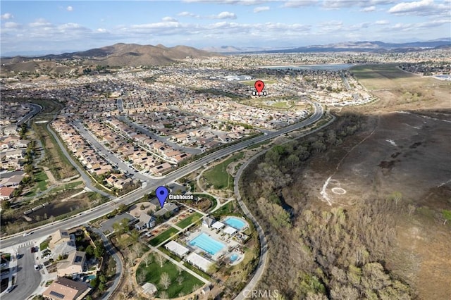 birds eye view of property featuring a mountain view