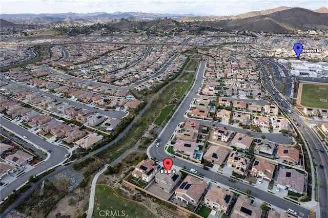 drone / aerial view with a residential view and a mountain view