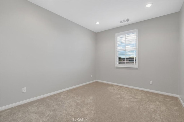 29945 Urtica Ct, Menifee, CA 92584 - empty room featuring light carpet, baseboards, visible vents, and recessed lighting