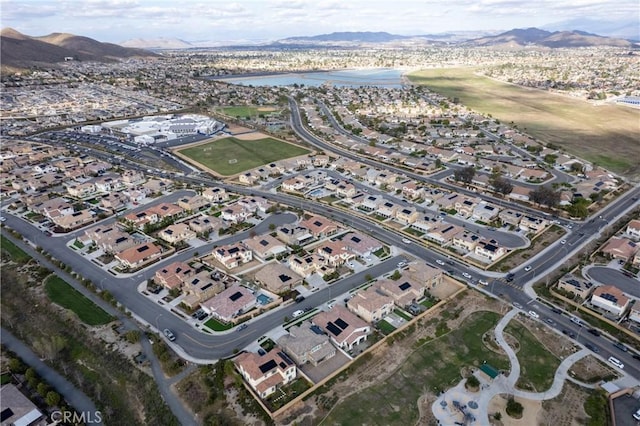 bird's eye view featuring a residential view and a water and mountain view