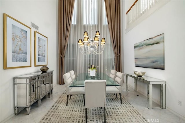 dining room with baseboards, visible vents, a notable chandelier, and tile patterned floors