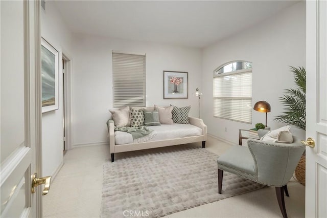 sitting room with light carpet and baseboards