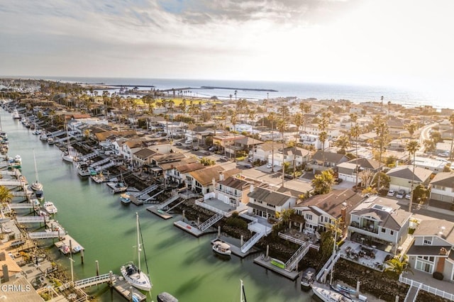 bird's eye view with a residential view and a water view