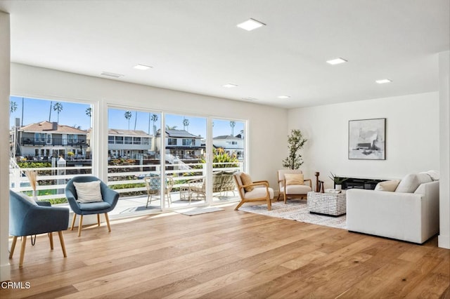 living room featuring wood finished floors and visible vents