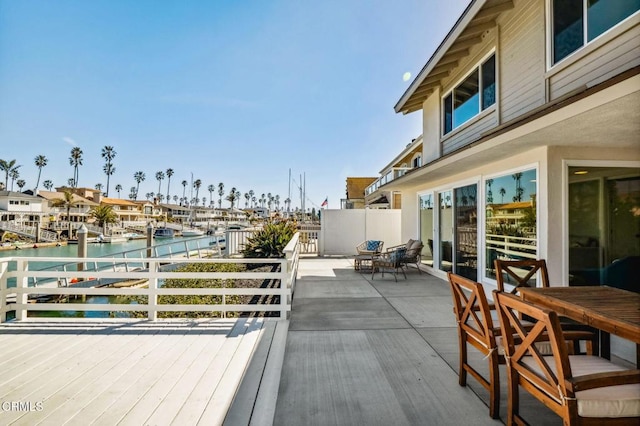 deck featuring a water view