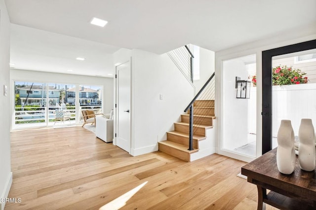 interior space featuring baseboards and wood finished floors