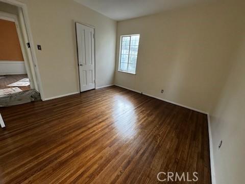 unfurnished room featuring wood finished floors