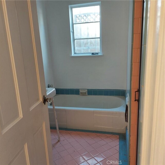 full bathroom with tile patterned floors and a garden tub