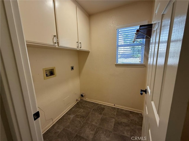 laundry area featuring washer hookup, cabinet space, baseboards, and hookup for an electric dryer