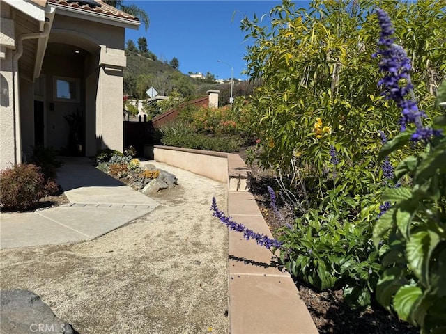 view of yard with a mountain view and fence