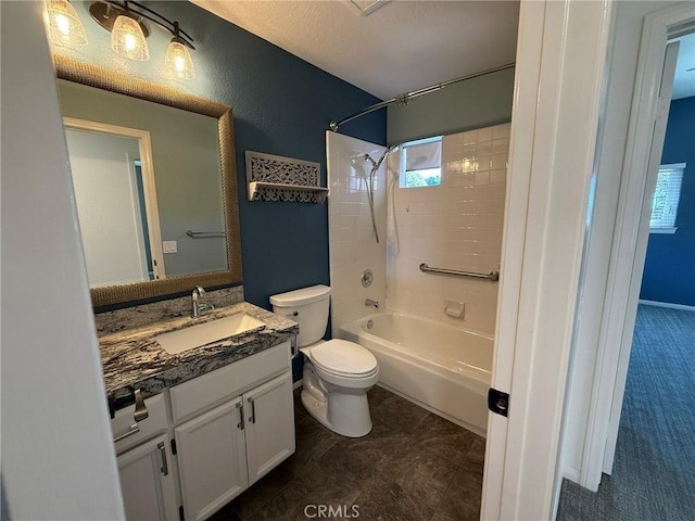 full bath featuring vanity, toilet, and bathtub / shower combination