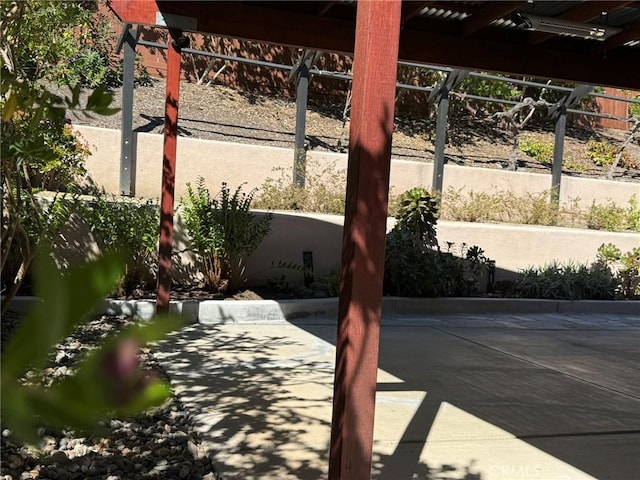 view of patio / terrace featuring fence