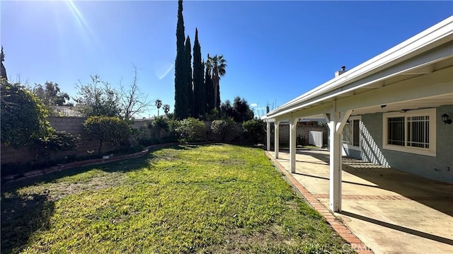 view of yard featuring a patio and a fenced backyard