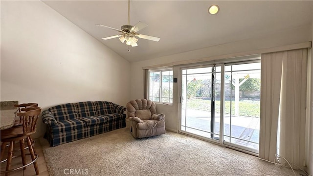 carpeted living room featuring lofted ceiling and ceiling fan