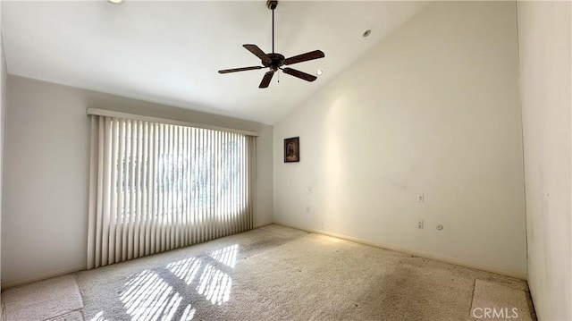 unfurnished room featuring high vaulted ceiling, carpet, and a ceiling fan