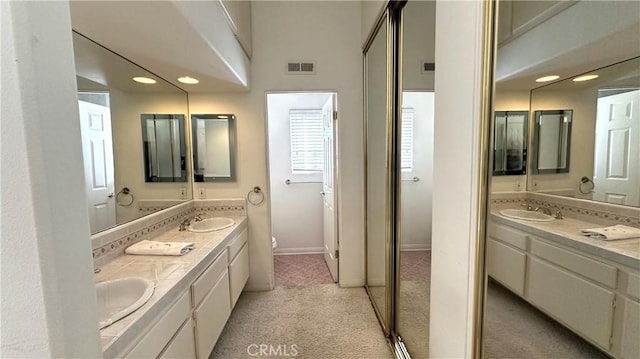 full bathroom featuring a sink, visible vents, and toilet