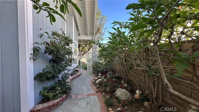 view of side of property featuring fence