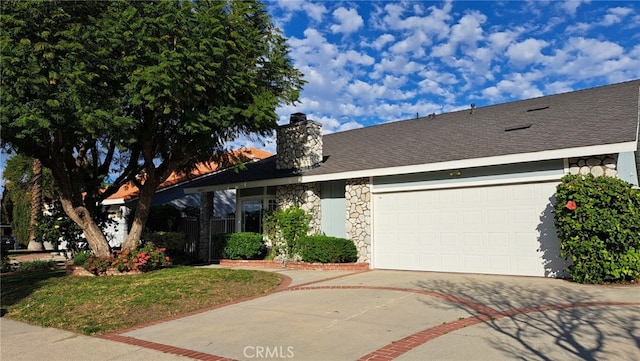 view of front of home with driveway, an attached garage, a shingled roof, a chimney, and stone siding