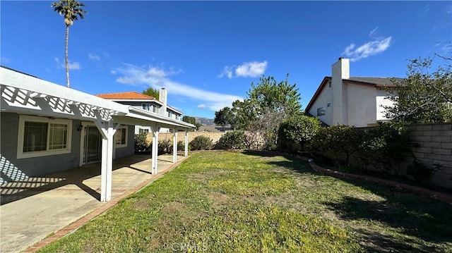 view of yard with a fenced backyard and a patio area