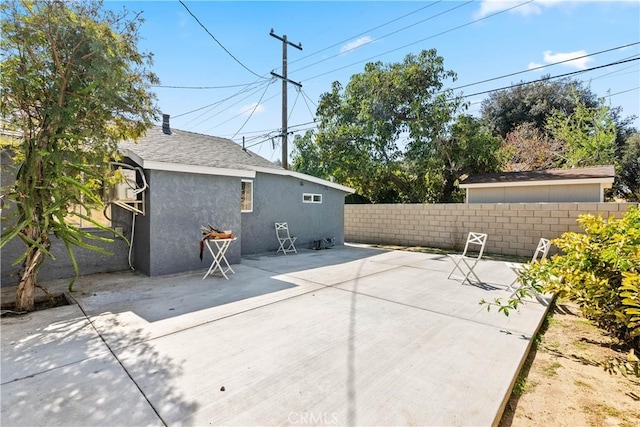 view of patio / terrace featuring fence