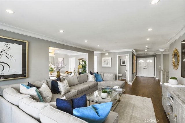 living area featuring ornamental molding, dark wood-type flooring, and recessed lighting