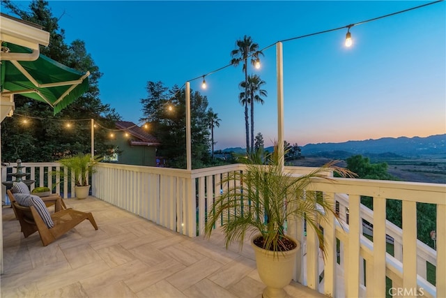 view of balcony at dusk