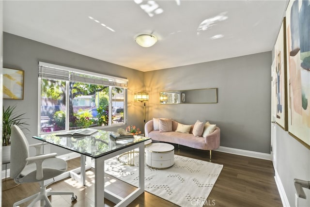 living room featuring baseboards and wood finished floors