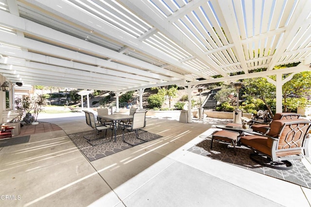 view of patio with a pergola and outdoor dining space